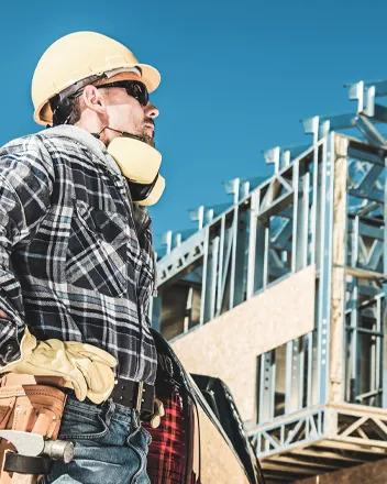 contractors going over a blueprint on public school project